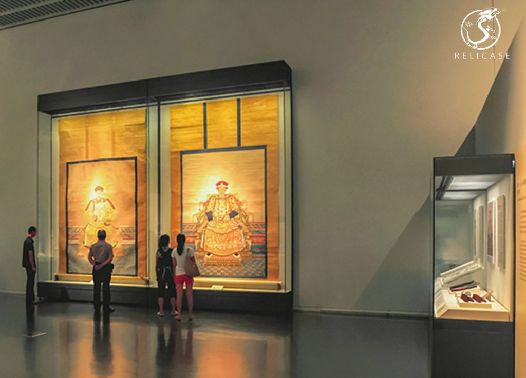 Large court dress museum wall display cases
